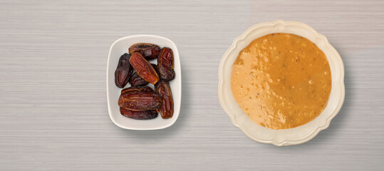 top view. Ramadan pita and lentil soup on wooden background