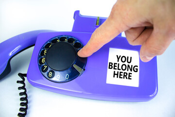 You belong here symbol. Old blue rotary dial telephone. Words 'You belong here'. Beautiful white...