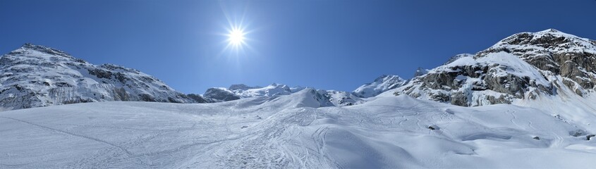 Obraz premium Panorama of the Bernina Group with Piz Bernina and Morteratsch Glacier with a clear blue sky and sunshine 