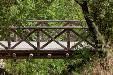 Wooden bridge over a deep ravine