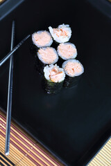 handmade fish sushi with rice served in an appetizing way