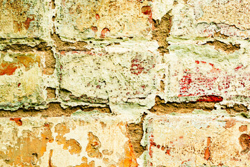 Texture of a brick wall with cracks and scratches which can be used as a background