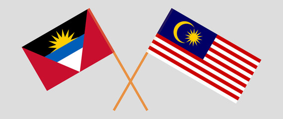 Crossed flags of Antigua and Barbuda and Malaysia. Official colors. Correct proportion