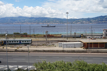 Railway station and ferry on Strait of Messina, narrow strait between eastern Sicily and western Calabria, transportation concept, Italy