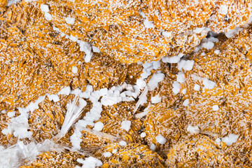 Close-up of texture from aragonite with beautiful clusters of crystals. Detail of orange and white mineral from calcium carbonate. Mineralogy. Collectable sample from Hridelec near Nova Paka, Czechia. - obrazy, fototapety, plakaty