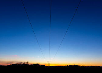 Power lines in sunset