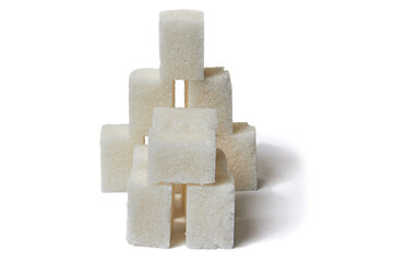 The pyramid is made of pieces of sugar isolated of white background Large depth of field