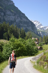 Fototapeta premium A young man hiking in the mountains