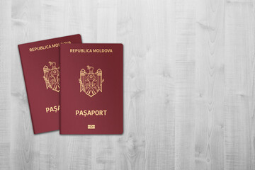 Moldovan passports are issued to citizens of the Republic of Moldova for the purpose of international travel, on wooden background