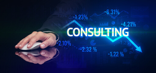 male hand holding wireless peripheral with CONSULTING inscription, modern business concept