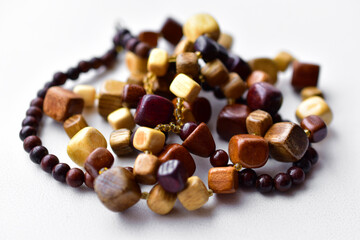 Beautiful wooden beads on a white background