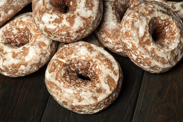 Homemade round gingerbread cookies with icing on a vintage table. The idea of a delicious breakfast or dinner