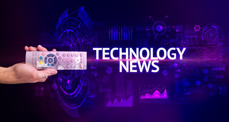 hand holding wireless peripheral with TECHNOLOGY NEWS inscription, modern technology concept