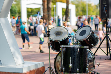 drum kits on the background of dancing people on the street