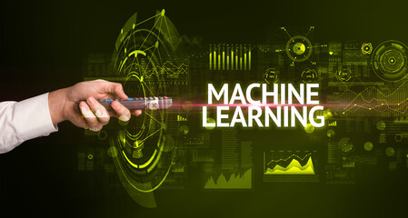 hand holding wireless peripheral with MACHINE LEARNING inscription, modern technology concept
