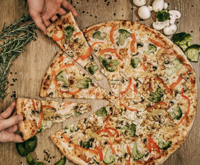 Vegetable pizza with bell peppers and broccoli and mushrooms