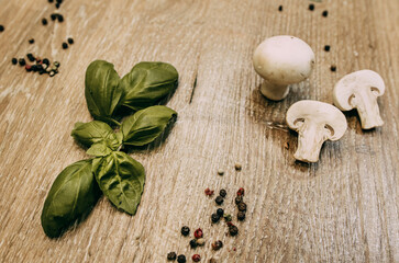 Basil leaves and sliced mushrooms