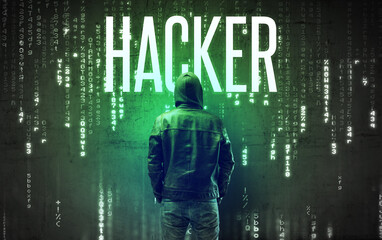 Faceless hacker with HACKER inscription, hacking concept