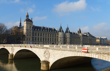 View of Conciergerie Castle and Bridge of Change over river Seine. Paris, France