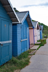 Fototapeta na wymiar Traditional wooden beach huts on Cromer seafront on the North Norfolk Coast