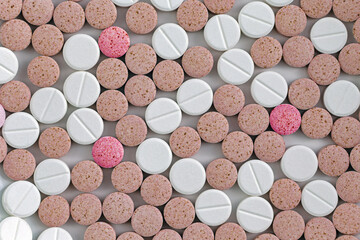 Colorful medical pills, tablets and capsules from above; color photo.
