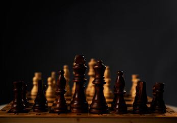 Chessboard with chess pieces on gray background with place for text