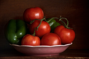 Tomatoes and Green Peppers in a Pink Bowl