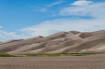 Great Sand Dunes National Park, Colorado, USA. Beautiful scenic majestic sand dunes and mountain peaks. Travel destination location for camping, hiking, relaxing and enjoying natures beauty.