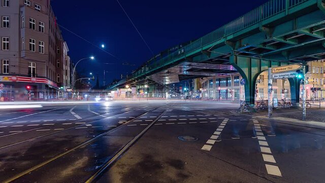 Night Time Lapse of Eberswalder Strasse with subway trams and cars Berlin, Germany