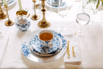 Blue vintage tea set on a table at a restaurant.