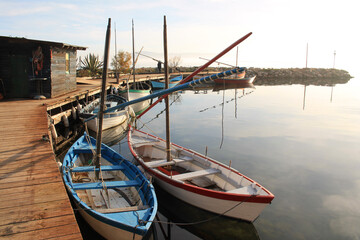 Fototapeta na wymiar Traditional wooden boats at Bouzigues, a beautiful fishing village in the Bassin de Thau, Herault, France 