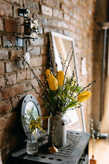 Bouquet of yellow tulips flowers in a vase. Spring flowers at home.