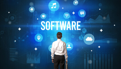 Rear view of a businessman with SOFTWARE inscription, modern technology concept
