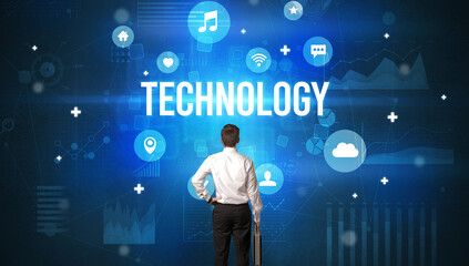 Rear view of a businessman with TECHNOLOGY inscription, modern technology concept