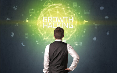 Rear view of a businessman with GROWTH HACKING inscription, online security concept