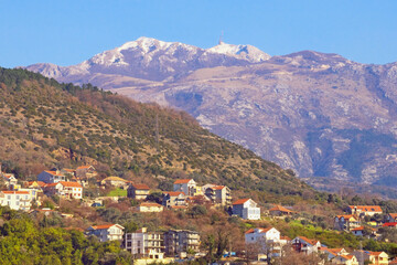 Fototapeta na wymiar Sunny mountain landscape. View of Lovcen mountain from Tivat city. Montenegro