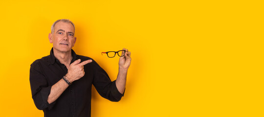 Isolated adult man pointing glasses isolated on background