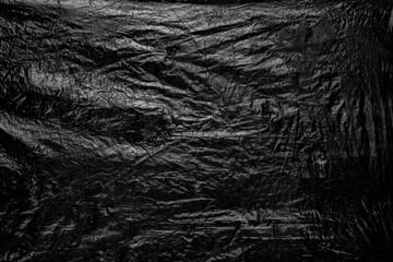 Dark crumpled grunge background, old film effect, dusty texture