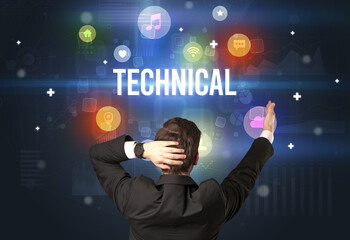 Rear view of a businessman with TECHNICAL inscription, modern technology concept