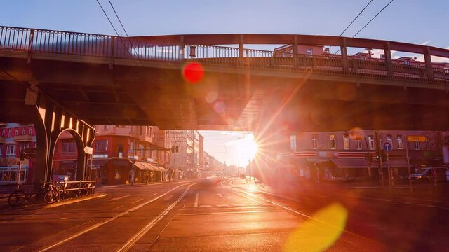 Sunrise Time Lapse of Eberswalder Strasse with subway trams and cars Berlin, Germany