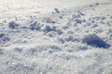 Large snowdrifts in a snowy meadow.