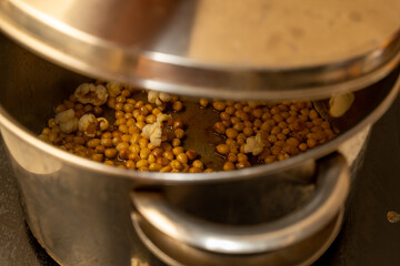 from corn kernels to popcorn in the kitchen pot