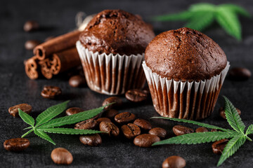 Cupcake with marijuana.traditional sponge cake with cannabis weed cbd. Medical marijuana drugs in food dessert, ganja legalization.Stack of chocolate slices with mint leaf on a wooden table.