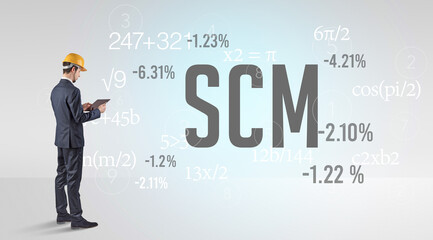 Technology Engineer in hard hat with SCM abbreviation