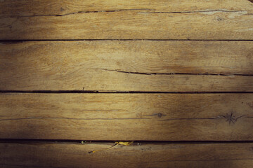 Obraz premium Texture of old wooden boards with sun spots. Horizontal format. Background for design. Place for text