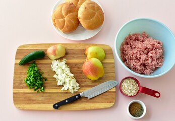 Homemade burger ingredients with gourmet fixings to make barbecue grilling picnic meal for summer season. Photo concept food background, flat lay, recipe
