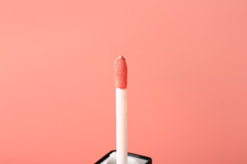 liquid pink lipstick gloss. cosmetic concept