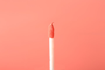 liquid pink lipstick gloss. cosmetic concept