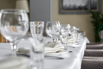 Empty wine glasses are on the table in the restaurant.