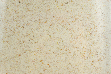 Close-up of ground oats in a glass pot